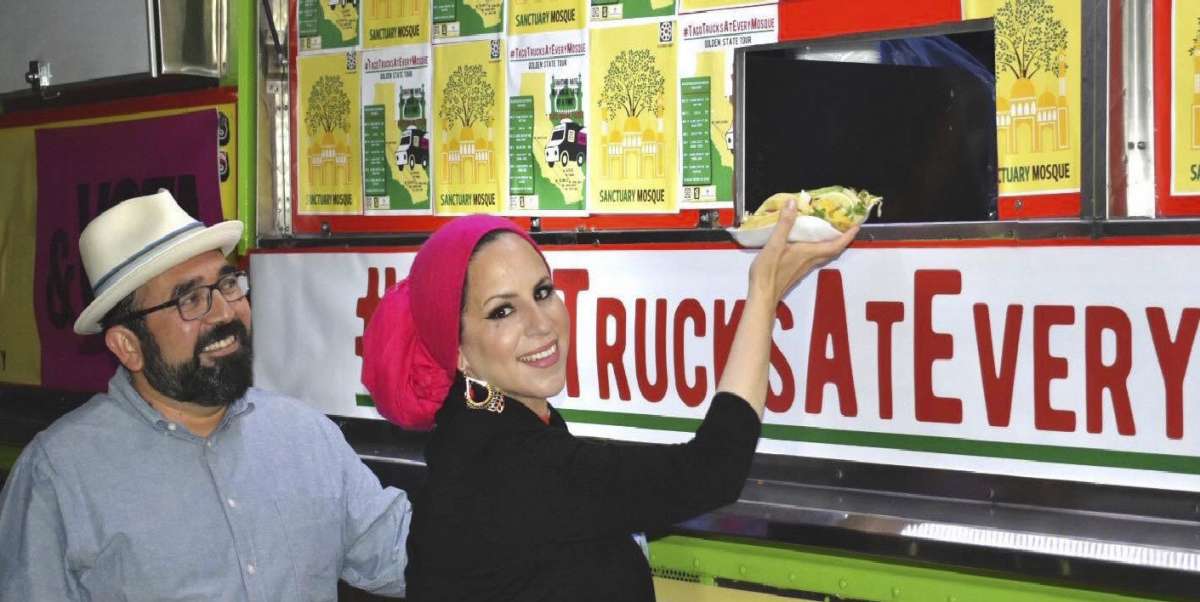 #TacoTrucksatEveryMosque co-founders Benjamin Vazquez, left, and Rida Hamida during a taco event. (Courtesy of Latino & Muslim Unity via AP)