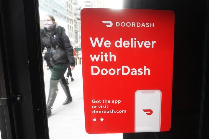 A restaurant displays a delivery by DoorDash sign in the Manhattan borough of New York City, New York, U.S., December 9, 2020. (Reuters)