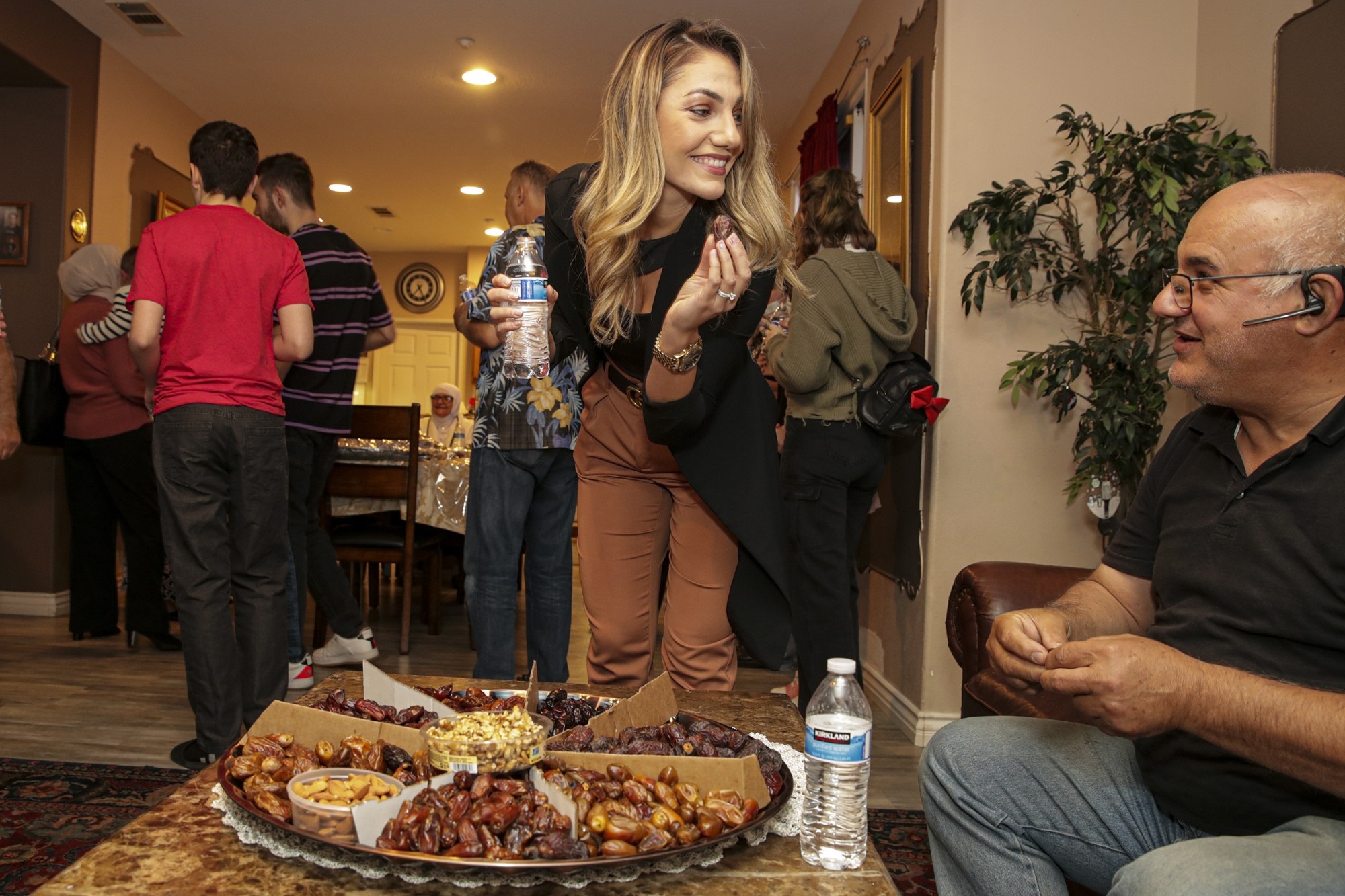 Aya Muhtaseb, left, and her father, Adnan Fejleh, look for a date to end their daily Ramadan fast on April 20 in Montclair.(Irfan Khan / Los Angeles Times)