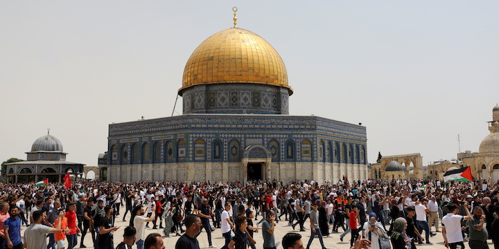 Palestinians walk at the compound that houses Al-Aqsa Mosque, known to Muslims as Noble Sanctuary and to Jews as Temple Mount, in Jerusalem’s Old City May 21, 2021. Photo: REUTERS/Ammar Awad TPX IMAGES OF THE DAY