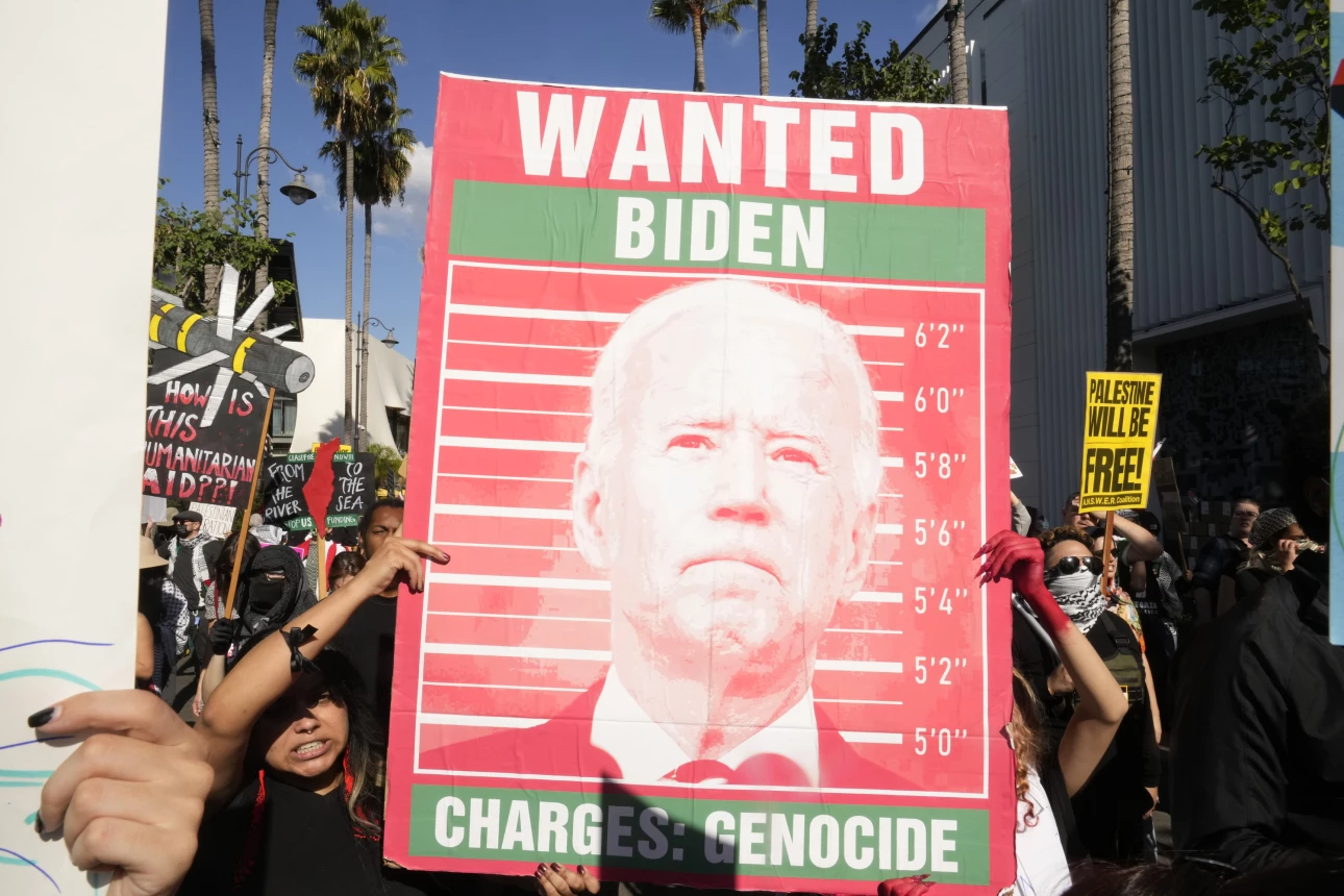 Pro-Palestinian demonstrators march on Black Friday, a popular U.S. shopping day after Thanksgiving, at a shopping center Friday, Nov. 24, 2023, in Los Angeles. (AP Photo/Damian Dovarganes) Damian Dovarganes/AP Biden