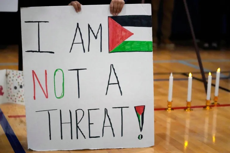 Easton Amjad Waz, 5, holds a sign during a vigil for Wadea Al Fayoume at in Plainfield, Illinois on October 17, 2023 [File: AP/Nam Y Huh]