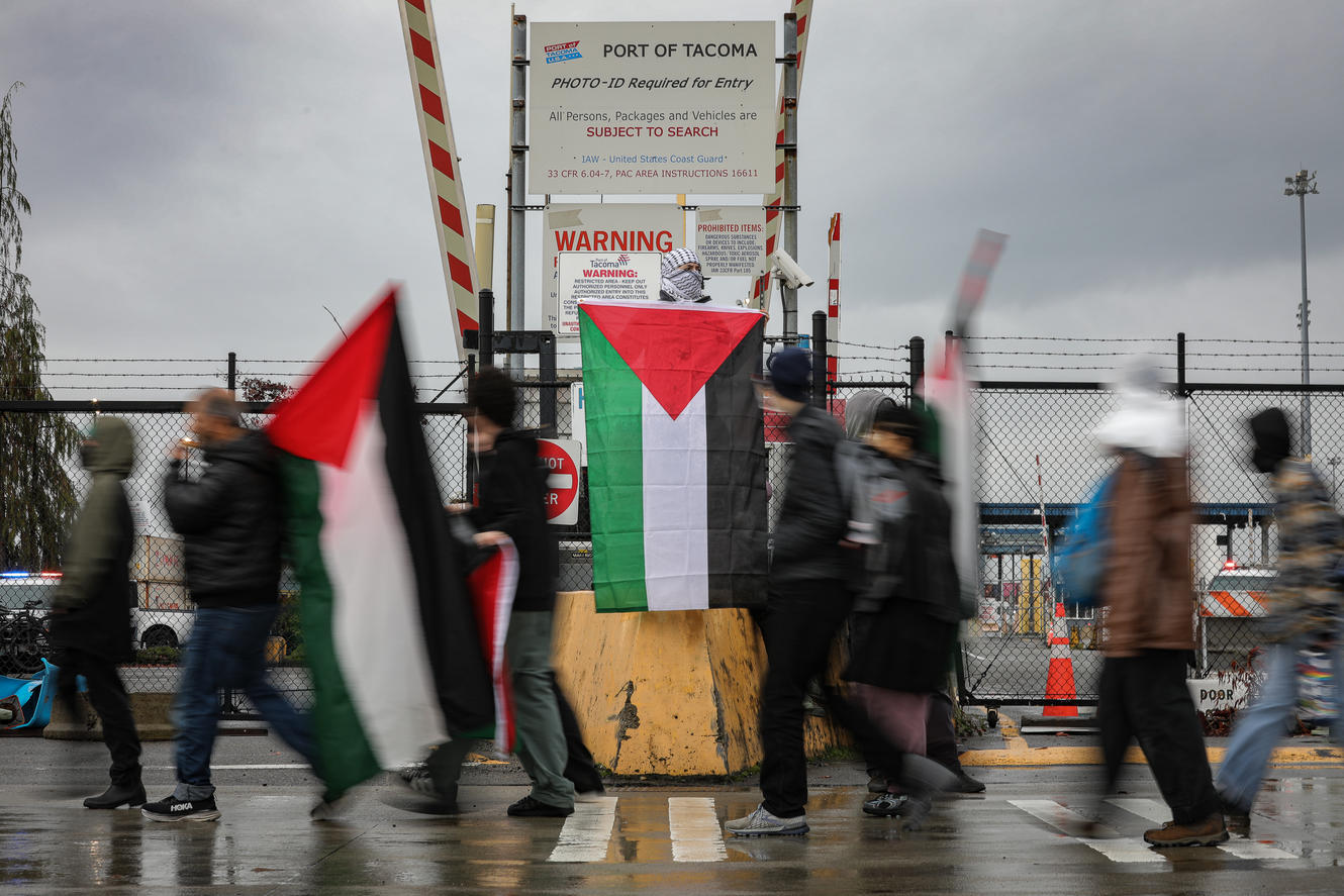 Hundreds of pro-Palestinian protesters gathered in front of the entrance to the Port of Tacoma, Monday afternoon, in an attempt to block a ship, the Cape Orlando, they believe is set to deliver weapons and military supplies to Israel. Demonstrators have been marching since 5 a.m. and more people and food donations have arrived over the course of the day. (Genna Martin/Crosscut)